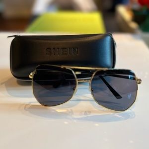 NWOT. Gold frame metal oversized sunglasses with black irregular black lens.